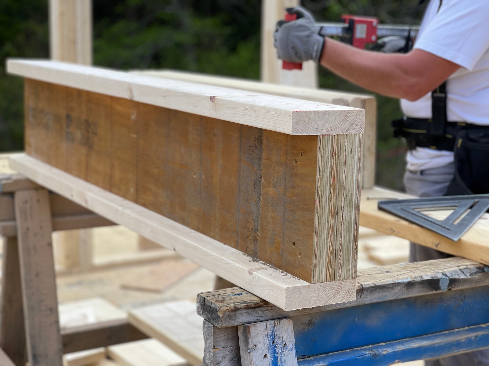 Carpenter squaring a glulam beam on a Lakeshore Construction jobsite