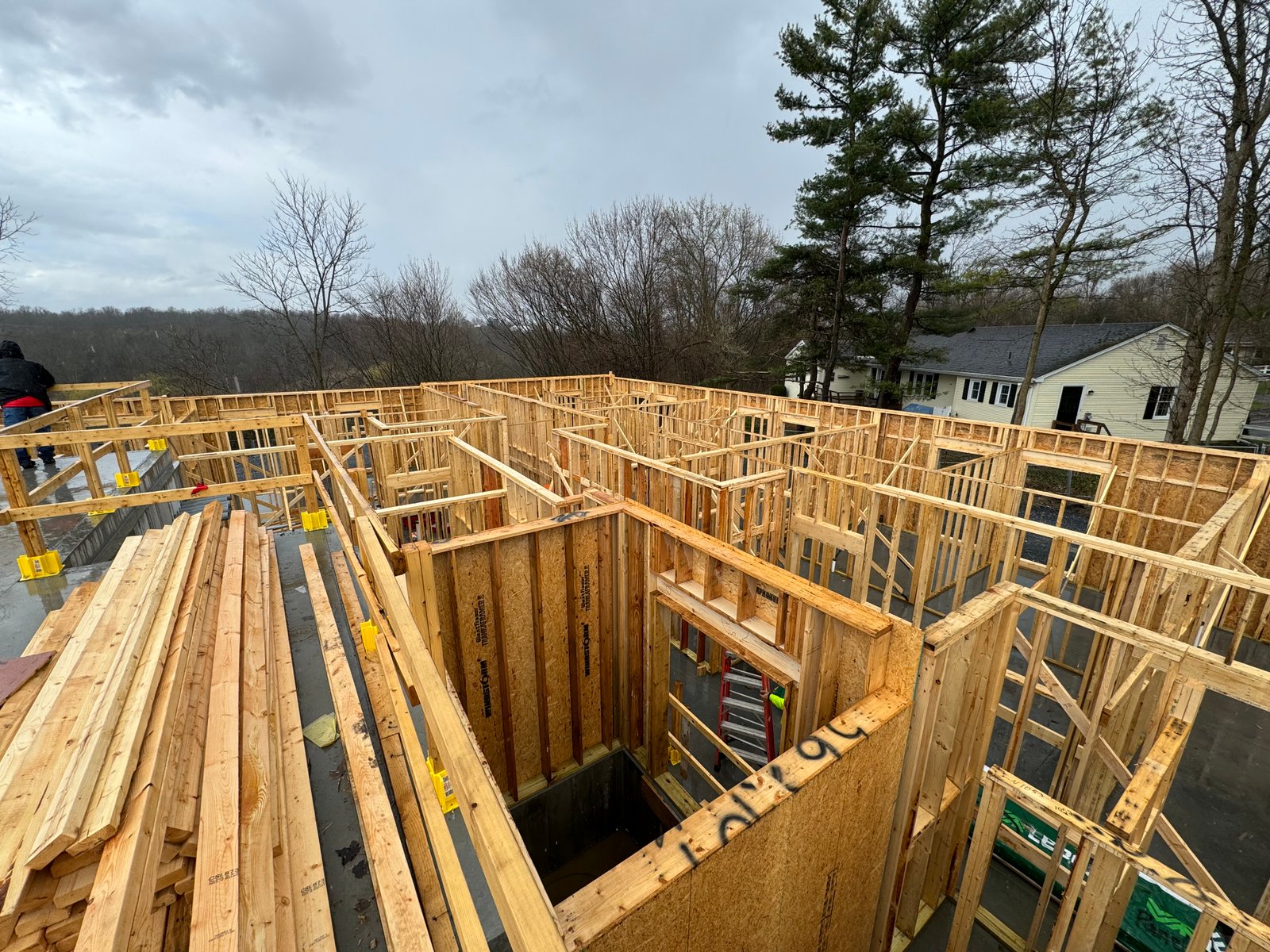 Rooftop view of framing on a Lakeshore Construction project